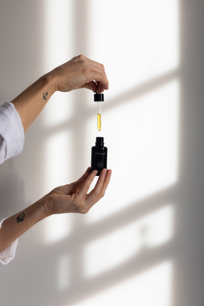 Inlight face oil hand dropper.webp