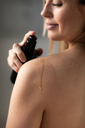 Inlight Organic Body Oil on shoulder.webp